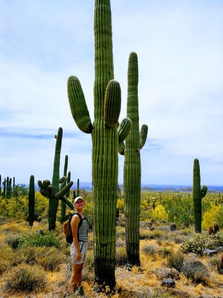 Smiling Next to Cactus